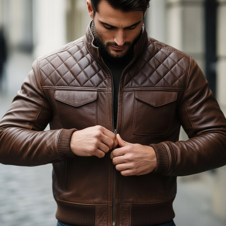 Man wearing a brown quilted leather jacket outdoors