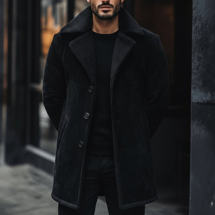 Man wearing a black coat in an urban setting