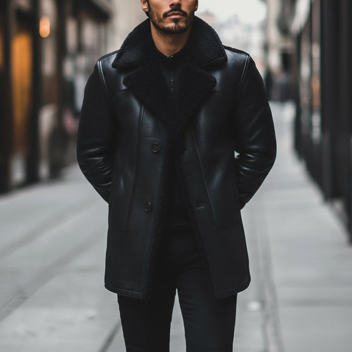 Man wearing a black leather coat on a city street