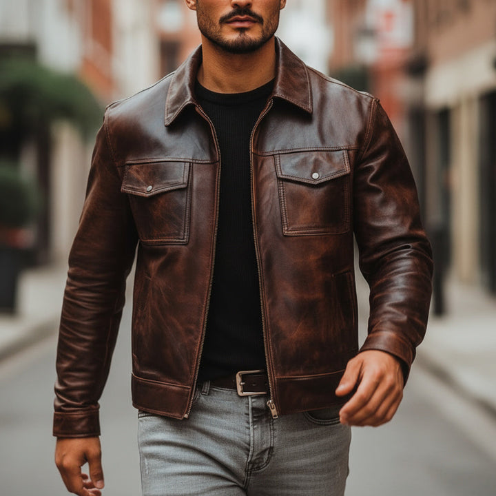 Man wearing a brown leather jacket on a city street