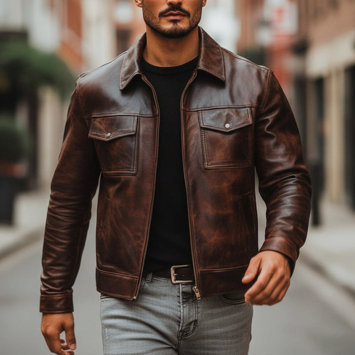 Man wearing a brown leather jacket on a city street