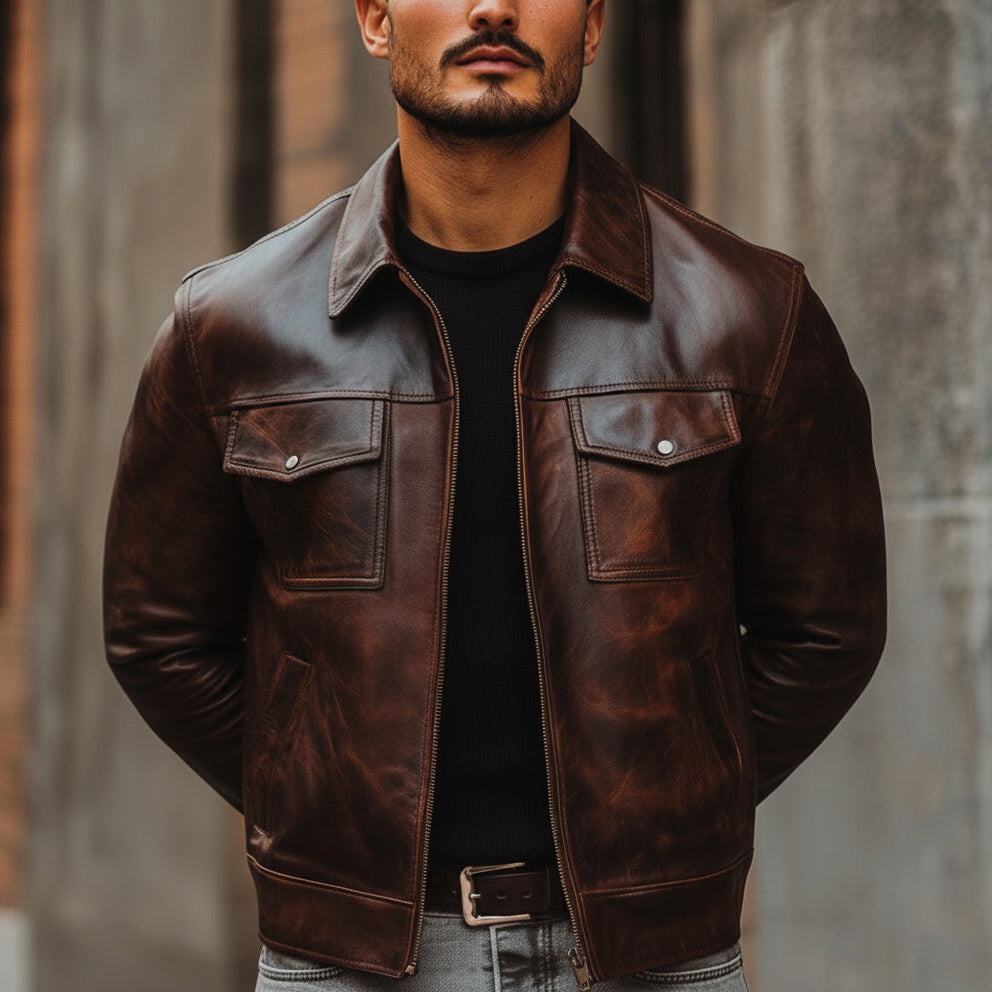 Man wearing a brown leather jacket with a blurred background