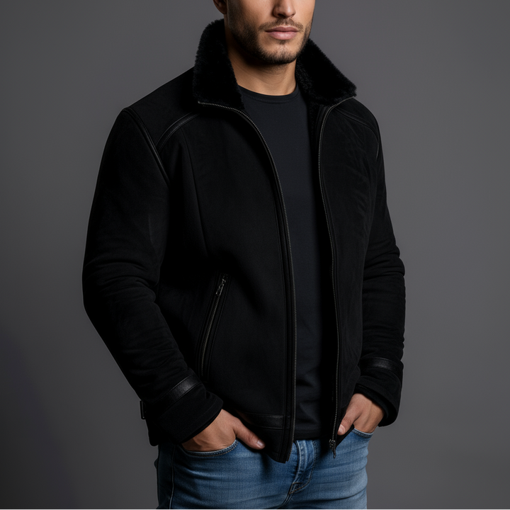 Man wearing a black jacket with a gray background