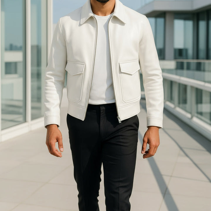 Man wearing a white jacket and black pants on a modern building rooftop.