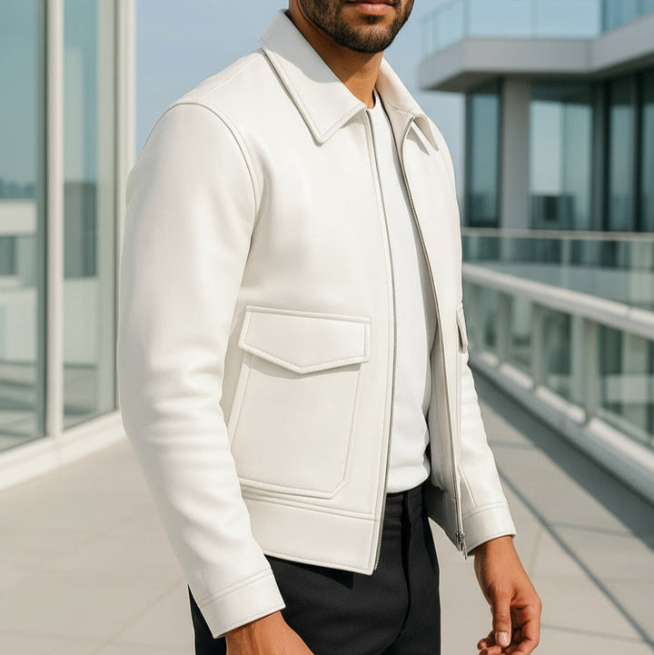 Man wearing a white jacket on a modern building rooftop